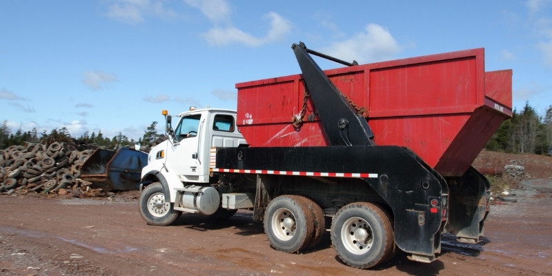 dumpster truck going to a landfill
