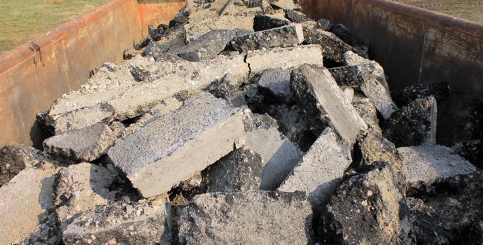 dumpster full of cement debris