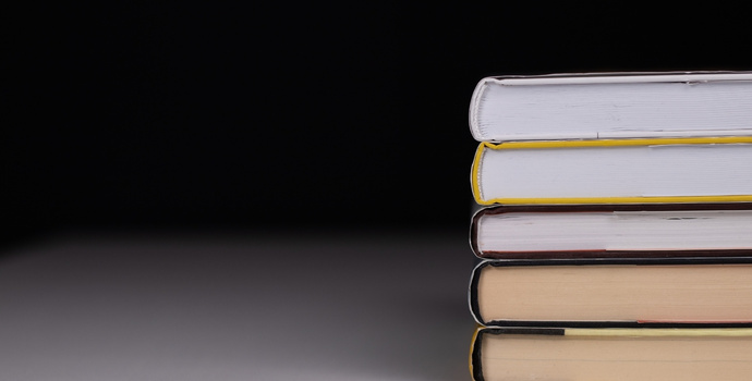 pile of books in black background