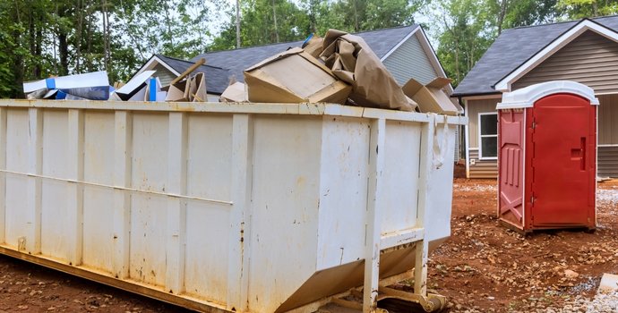 white dumpster full of items