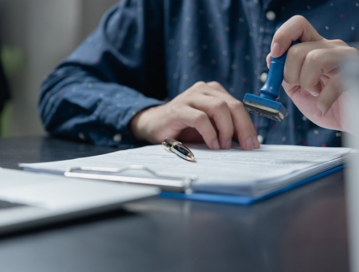 inspector stamping approval in a document