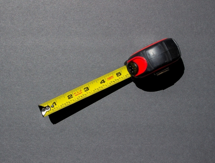 measuring tape in gray background