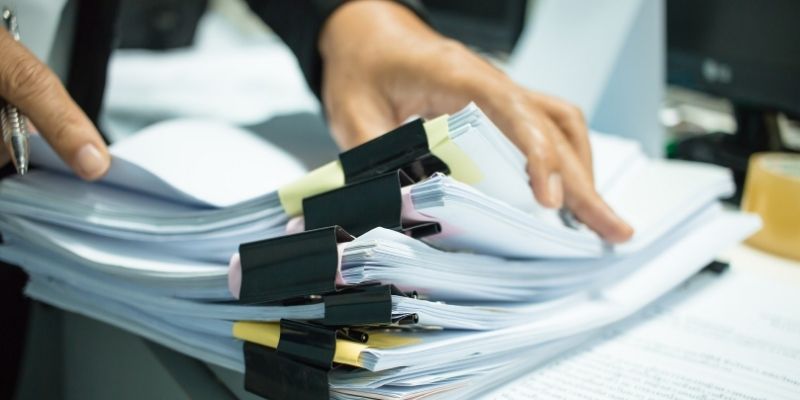 pile of documents sorted by paper clips