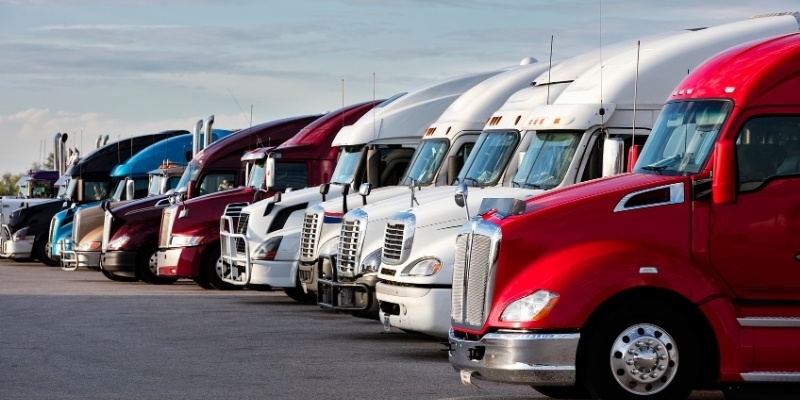 roll off container trucks parked